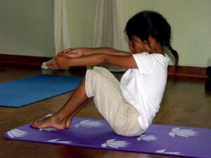 girl doing yoga How to reduce screen time for toddlers